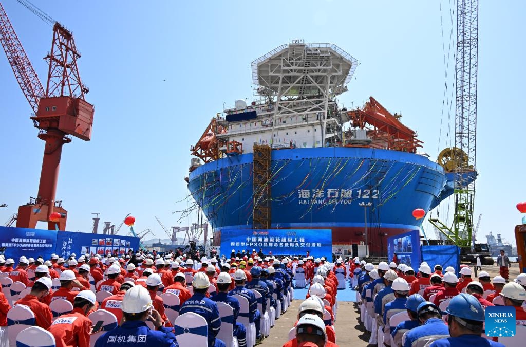 A delivery ceremony of Haikui No. 1, Asia's first cylindrical floating, production, storage, and offloading (FPSO) facility, is held in Qingdao, east China's Shandong Province, April 26, 2024. Designed and built by China, Haikui No. 1 was completed and delivered in Qingdao on Friday. With a maximum displacement of 100,000 tons and storage capacity of 60,000 tons of oil, the facility is capable of operating for 15 years at sea without returning to dock.(Photo: Xinhua)