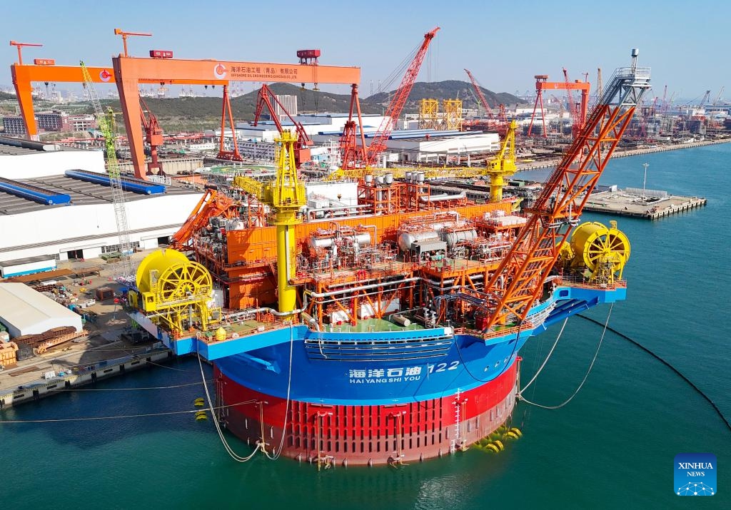 An aerial drone photo taken on April 26, 2024 shows Haikui No. 1, Asia's first cylindrical floating, production, storage, and offloading (FPSO) facility, in Qingdao, east China's Shandong Province. Designed and built by China, Haikui No. 1 was completed and delivered in Qingdao on Friday. With a maximum displacement of 100,000 tons and storage capacity of 60,000 tons of oil, the facility is capable of operating for 15 years at sea without returning to dock.(Photo: Xinhua)