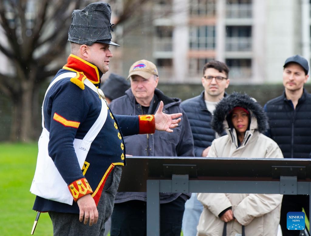 A docent speaks to visitors during the Battle of York Day ceremony at Fort York National Historic Site in Toronto, Canada, on April 27, 2024. Hundreds of visitors participated in the 211th anniversary of the Battle of York with special tours and demonstrations on Saturday in Toronto.(Photo: Xinhua)