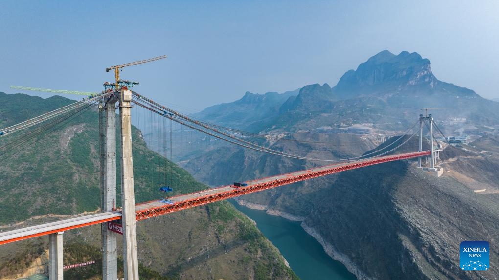 An aerial drone photo taken on April 28, 2024 shows the construction site of Zangke River bridge on Nayong-Qinglong Expressway in southwest China's Guizhou Province. The closure of the bridge, featuring a length of 1,849 meters and a span of 1,080 meters, has been successfully completed on Sunday.(Photo: Xinhua)
