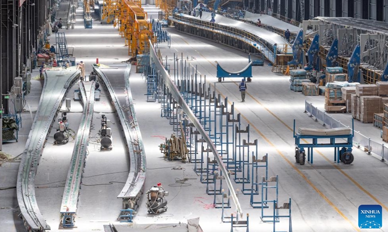 A staff member works at a workshop of China First Heavy Industries (CFHI) in Qiqihar, northeast China's Heilongjiang Province, April 28, 2024.

As a leading enterprise in equipment manufacturing in China, CFHI has made efforts to adopt green technologies, integrate the new energy equipment manufacturing into its main business, and form the complete industrial chain synchronously, improving manufacturing capability of wind turbines in Qiqihar and surrounding areas. (Xinhua/Xie Jianfei)