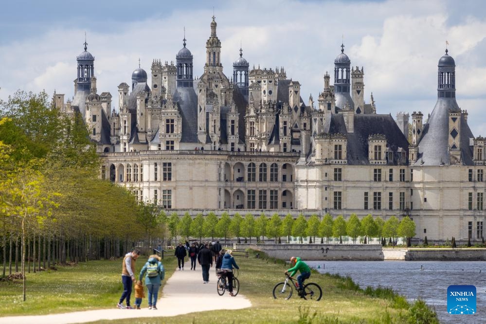 Tourists visit the Chambord Castle in Loire Valley, France, April 28, 2024. The chateaux of the Loire Valley are part of the architectural heritage of the historic towns of Amboise, Angers, Blois, Chinon, Montsoreau, Orleans, Saumur, and Tours along the river Loire in France. They illustrate Renaissance ideals of design in France.(Photo: Xinhua)