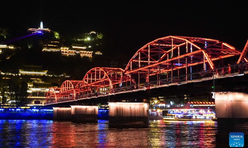 This photo taken on April 26, 2024 shows a night view of Zhongshan bridge at Chengguan District in Lanzhou, capital of northwest China's Gansu Province. As the May Day holiday is approaching, Lanzhou has continued to promote the development of night economy, releasing new vitality for consumption. (Xinhua/Ma Xiping)