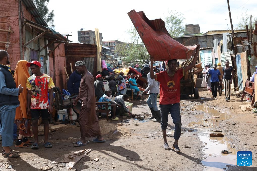 People in the Mathare slums wait to be relocated to temporary shelters in Nairobi, Kenya, on May 3, 2024. The death toll from the raging floods and landslides triggered by heavy rains in Kenya since March has risen to 210, with dozens of people still missing, the government announced on Friday.(Photo: Xinhua)