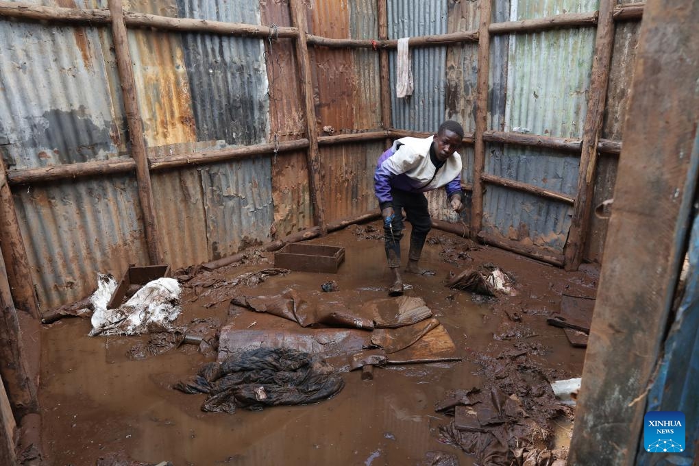 A resident in the Mathare slums collects items before being relocated to a temporary shelter in Nairobi, Kenya, on May 3, 2024. The death toll from the raging floods and landslides triggered by heavy rains in Kenya since March has risen to 210, with dozens of people still missing, the government announced on Friday. (Photo: Xinhua)