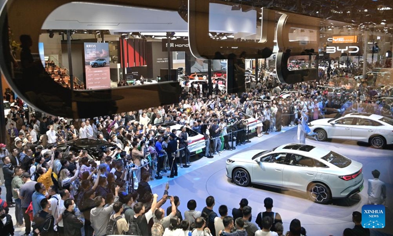 Visitors are seen at the exhibition area of Chinese NEV manufacturer BYD during the 2024 Beijing International Automotive Exhibition in Beijing, capital of China, May 4, 2024. The exhibition closed on Saturday. Photo: Xinhua