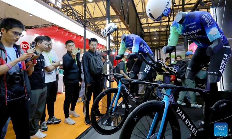 People visit the booth of VAN RYSEL during the 32nd China International Bicycle Fair in east China's Shanghai, May 5, 2024. The event kicked off here on Sunday, drawing about 1,460 enterprises to participate. Photo: Xinhua