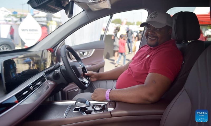 Isaac Pheko, a Botswana motorist journalist, sits in a Chery Tiggo 8 Pro Max during the 9th edition of the Shell Gaborone Motor Show in Gaborone, the Botswanan capital, May 3, 2024. Photo: Xinhua