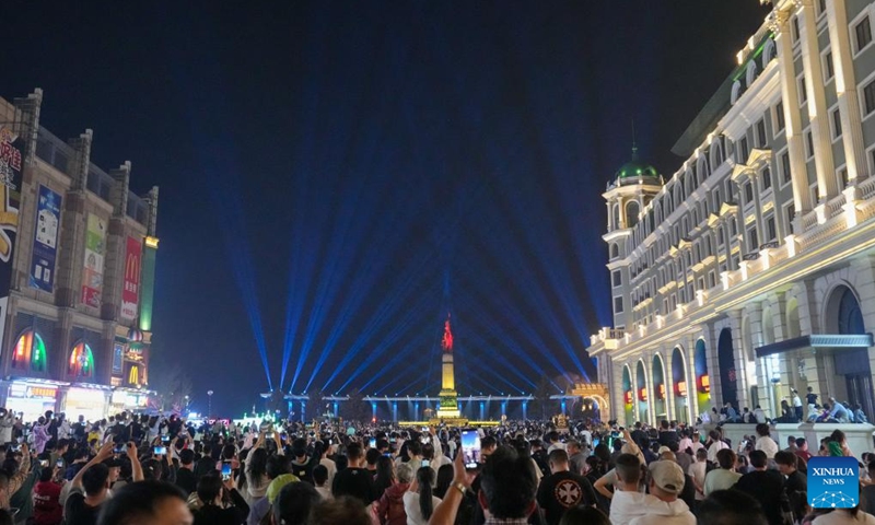 People watch a light show held at a square in Harbin, capital of northeast China's Heilongjiang Province, May 3, 2024. Photo: Xinhua