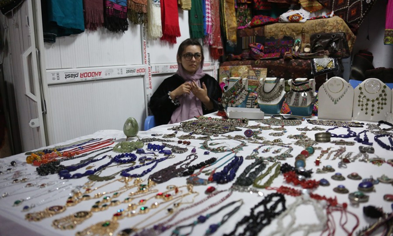 A woman sells goods at an exhibition of agricultural products and other Afghan commodities in Kabul, the capital of Afghanistan, May 1, 2024. Photo: Xinhua