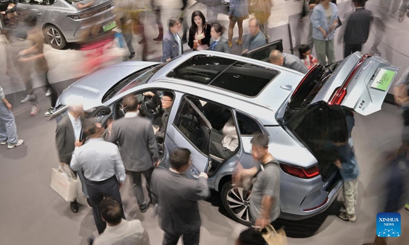 Visitors watch a vehicle of Song PLUS by Chinese NEV manufacturer BYD during the 2024 Beijing International Automotive Exhibition in Beijing, capital of China, May 4, 2024. The exhibition closed on Saturday. Photo: Xinhua