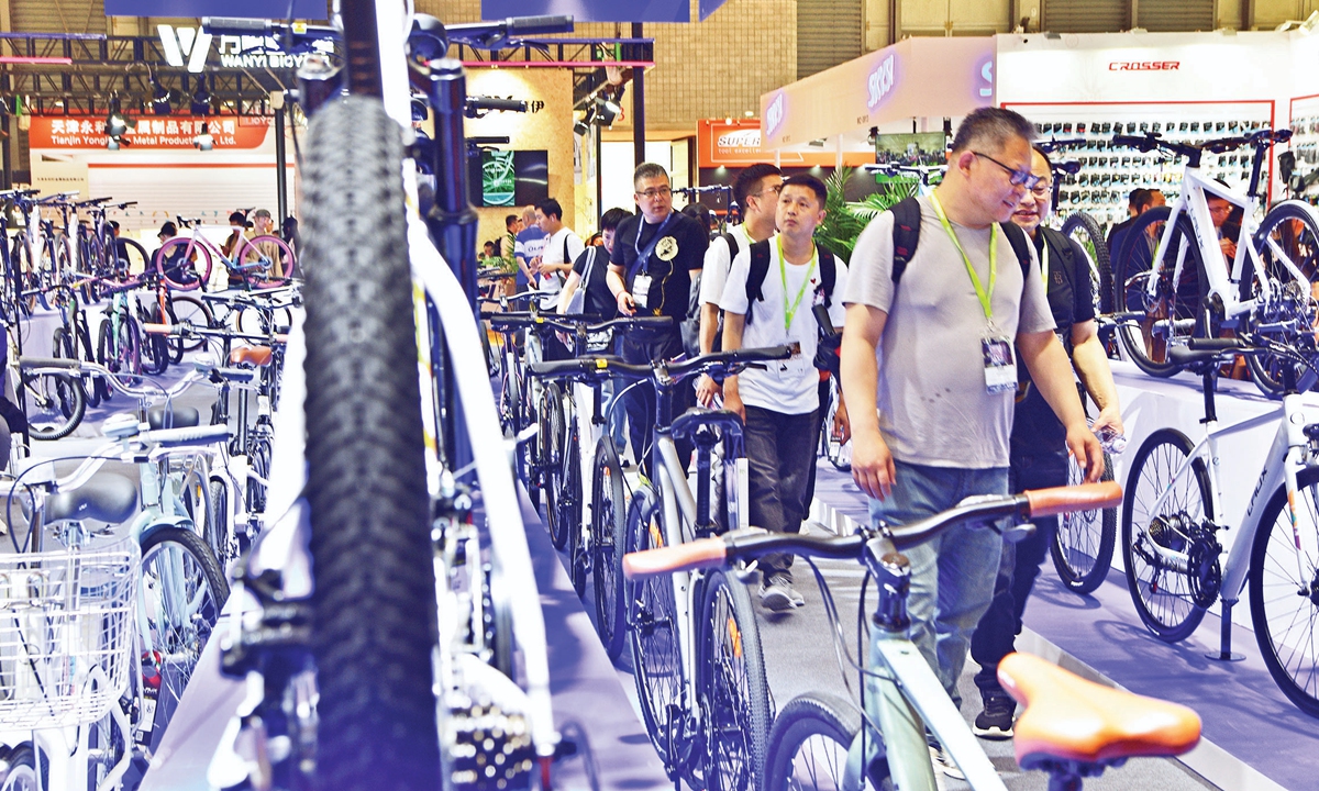 Visitors check out the bicycles and bicycle-related products exhibited during the 32nd China International Bicycle Fair in East China's Shanghai on May 5, 2024. The event kicked off on Sunday, attracting the participation of about 1,460 enterprises. (See story on Page 10) Photo: VCG