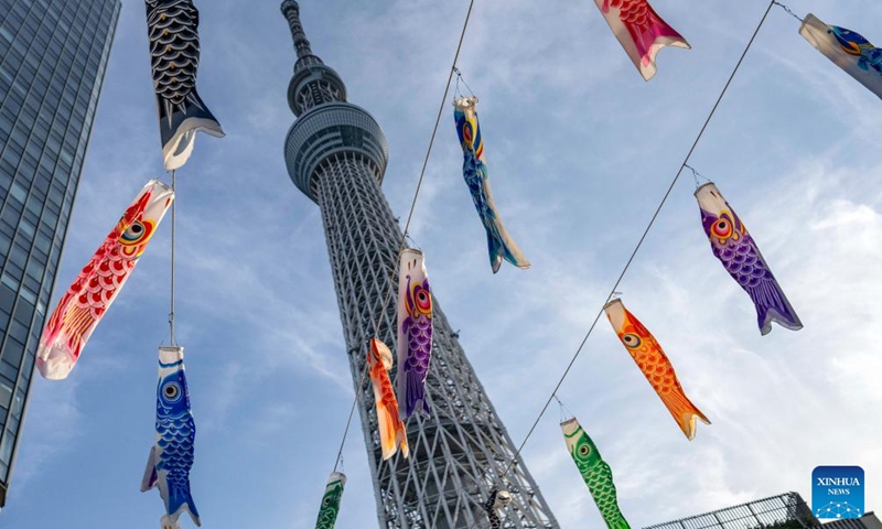 Traditional carp-shaped windsocks called Koinobori, a symbol of good health and strength for children, are hung up to celebrate the Children's day in Tokyo, Japan, on May 5, 2024. Photo: Xinhua
