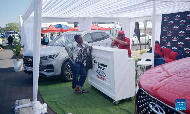 A visitor asks about the Chery brand during the 9th edition of the Shell Gaborone Motor Show in Gaborone, the Botswanan capital, May 3, 2024. Photo: Xinhua