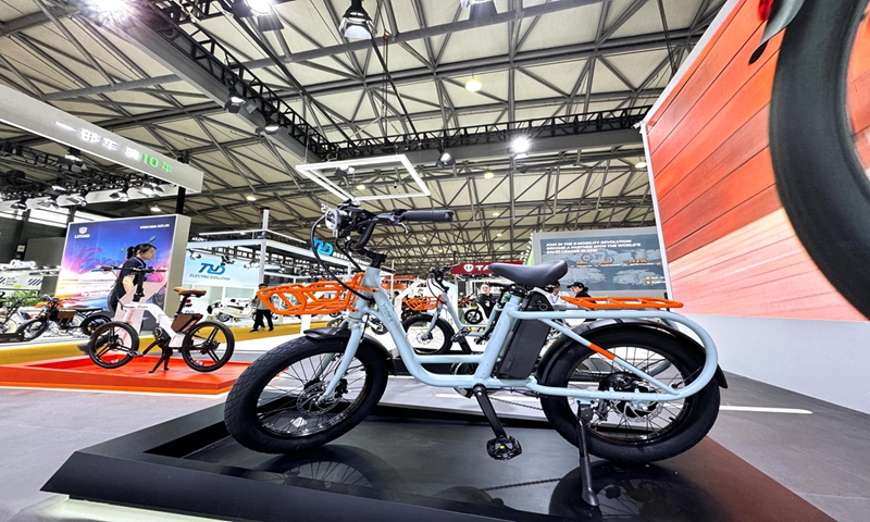 Yadea, a company that offers a wide range of electric vehicles including tricycles, skateboards and e-bikes, brings its latest designs to the expo. Photo: Liu Caiyu/GT  