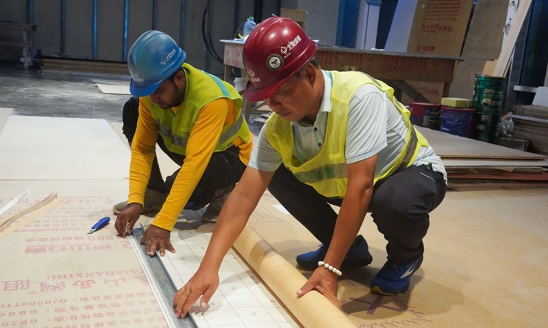 A Chinese employee of the Beijing Urban Construction Group (BUCG) and a foreign employee operate during the final decoration for the second phase of the VIP terminal of the Velana International Airport in Male, the Maldives, April 28, 2024. Photo: Xinhua