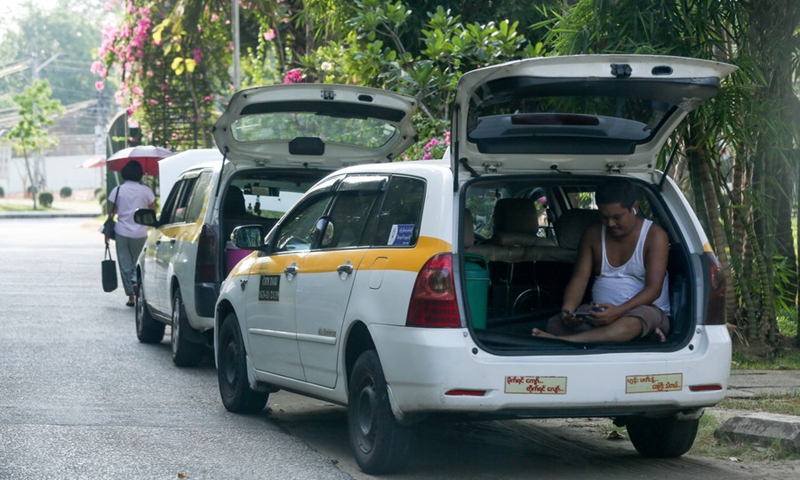 A taxi driver takes a rest inside his car on a hot day in Yangon, Myanmar, May 4, 2024. Photo: Xinhua