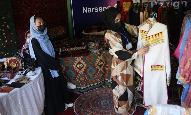 Women sell goods at an exhibition of agricultural products and other Afghan commodities in Kabul, the capital of Afghanistan, May 1, 2024. Photo: Xinhua