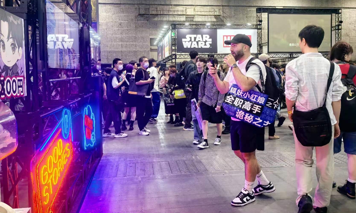 A fan takes a video at the China Literature's exhibition area of the Osaka Comic Con 2024 in Osaka, Japan. Photo: Courtesy of China Literature