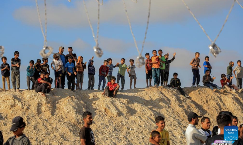 People watch a group wedding at a temporary camp in the southern Gaza Strip city of Khan Younis, May 3, 2024. Photo: Xinhua