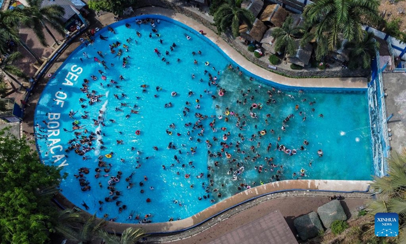An aerial drone photo taken on May 5, 2024 shows people cooling off in a swimming pool at a resort in Bulacan Province, the Philippines. People spend time at pools to cool off amid heatwave in the Philippines. Photo: Xinhua