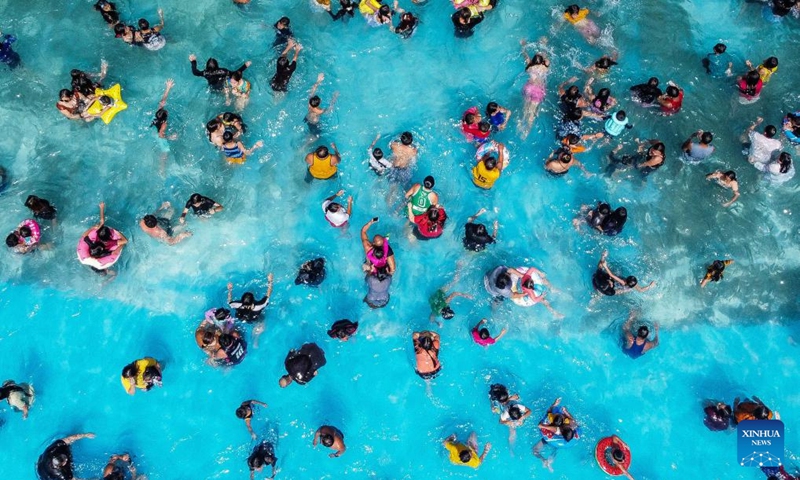 An aerial drone photo taken on May 5, 2024 shows people cooling off in a swimming pool at a resort in Bulacan Province, the Philippines. People spend time at pools to cool off amid heatwave in the Philippines. Photo: Xinhua
