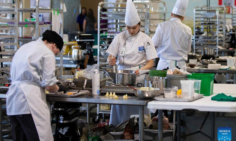 Students compete during the baking contest of the 2024 Skills Ontario Competition in Toronto, Ontario, Canada, on May 6, 2024. The 2024 Skills Ontario Competition kicked off here on Monday, attracting more than 2,800 competitors. A broad range of skills and careers are represented during the three-day competition from the manufacturing, construction, service, and technology sectors(Photo: Xinhua)