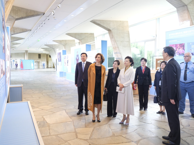 The United Nations Educational, Scientific and Cultural Organization (UNESCO) Director-General Audrey Azoulay accompanies Peng Liyuan, wife of Chinese President Xi Jinping, also a UNESCO special envoy for the advancement of girls' and women's education, to visit an exhibition on the ten-year achievements of cooperation between China and UNESCO, in Paris, France, May 6, 2024. Peng visited the UNESCO headquarters on Monday morning in Paris on invitation and met with Azoulay.(Photo: Xinhua)
