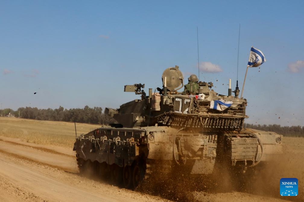 An Israeli tank is seen near the Shalom Kerem crossing in southern Israel bordering the Gaza Strip, on May 6, 2024. Israeli media reported on Monday that Israel's war cabinet has approved the launch of a ground offensive on Rafah that would take place after the civil population is evacuated.(Photo: Xinhua)