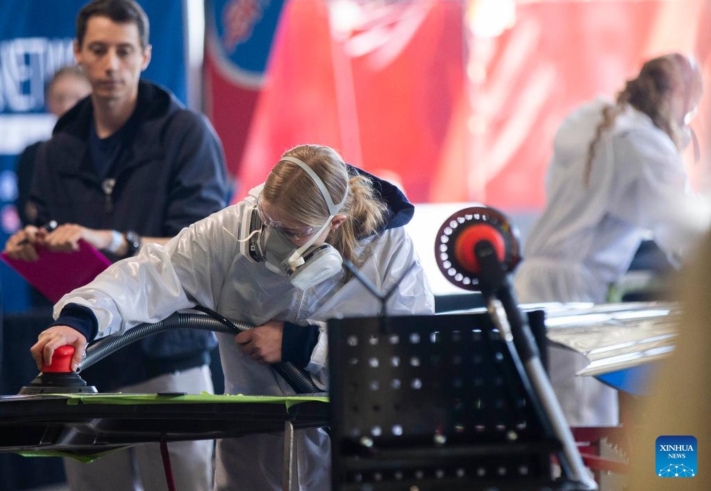 A student competes during the auto painting contest of the 2024 Skills Ontario Competition in Toronto, Ontario, Canada, on May 6, 2024. The 2024 Skills Ontario Competition kicked off here on Monday, attracting more than 2,800 competitors. A broad range of skills and careers are represented during the three-day competition from the manufacturing, construction, service, and technology sectors.(Photo: Xinhua)