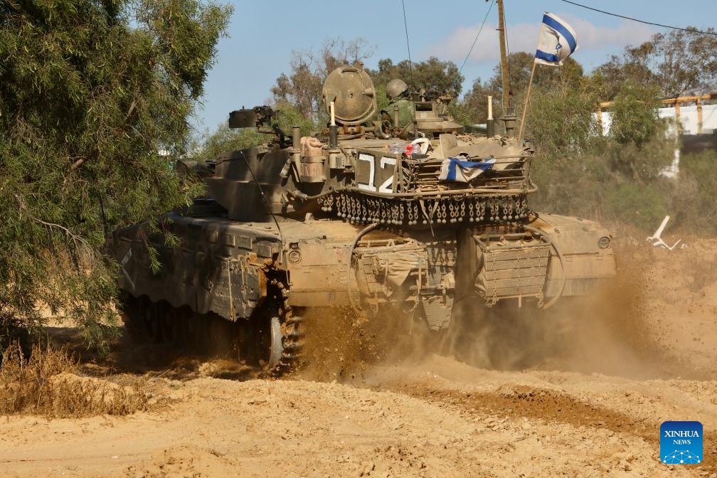 An Israeli tank is seen near the Shalom Kerem crossing in southern Israel bordering the Gaza Strip, on May 6, 2024. Israeli media reported on Monday that Israel's war cabinet has approved the launch of a ground offensive on Rafah that would take place after the civil population is evacuated.(Photo: Xinhua)