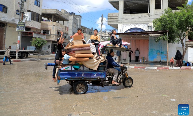 People leave their home in the southern Gaza Strip city of Rafah, on May 6, 2024. Israel's military said on Monday night that it was carrying out large-scale airstrikes in Gaza's southernmost city Rafah. Earlier in the day, Israel said it had asked civilians to evacuate from eastern Rafah ahead of a planned ground assault.(Photo: Xinhua)