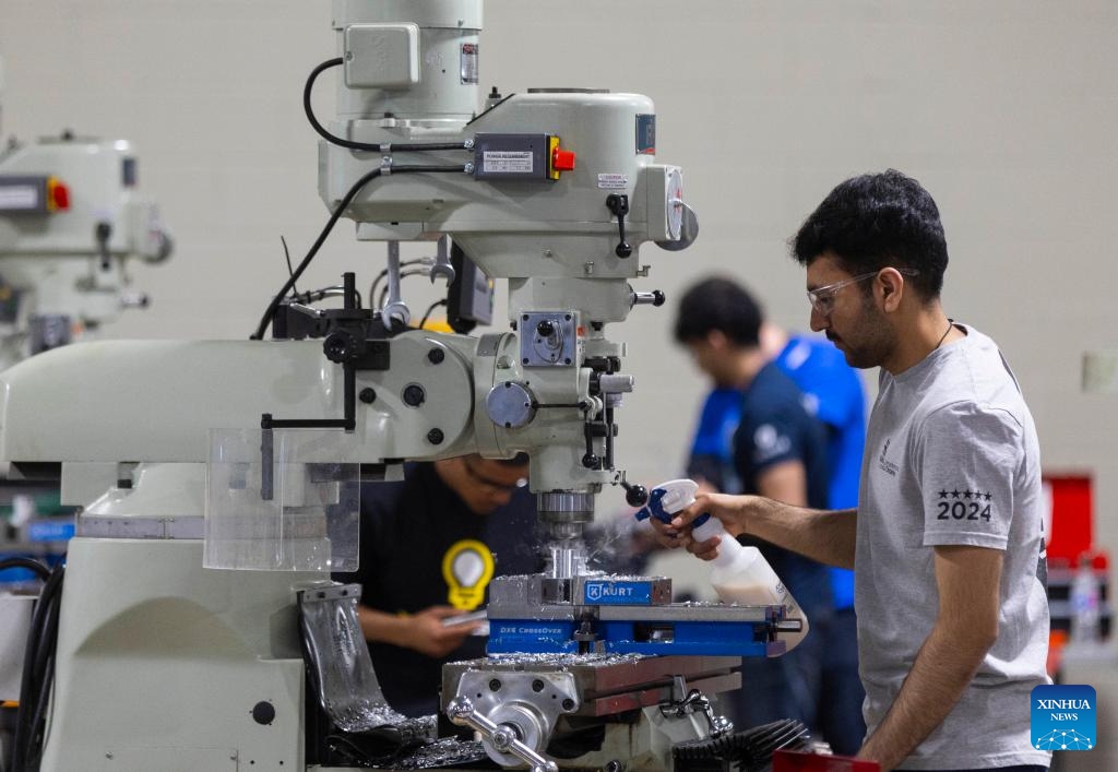 A student competes during the precision machining contest of the 2024 Skills Ontario Competition in Toronto, Ontario, Canada, on May 6, 2024. The 2024 Skills Ontario Competition kicked off here on Monday, attracting more than 2,800 competitors. A broad range of skills and careers are represented during the three-day competition from the manufacturing, construction, service, and technology sectors.(Photo: Xinhua)