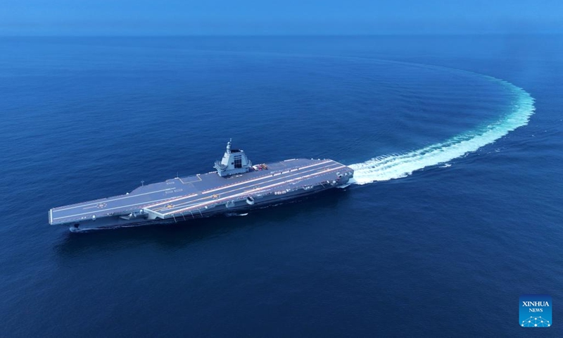 An aerial drone photo taken on May 7, 2024 shows China's third aircraft carrier, the <em>Fujian</em>, during its maiden sea trials. China's third aircraft carrier, the <em>Fujian</em>, completed maiden sea trials on Wednesday.(Photo: Xinhua)