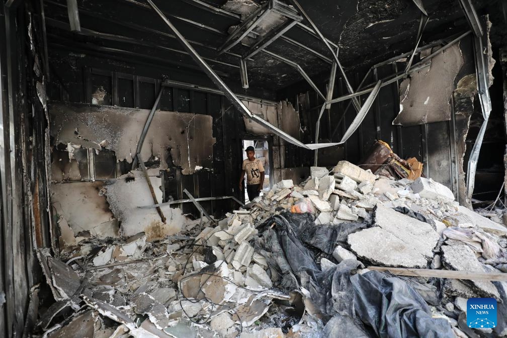 A boy is seen in a destroyed house after an Israeli military operation in the city of Tulkarm in the northern West Bank, on May 7, 2024.(Photo: Xinhua)