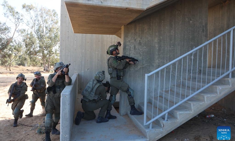 Israeli soldiers take part in a drill before entering Gazan city of Rafah near the Kerem Shalom crossing in Israel, on May 7, 2024.(Photo: Xinhua)