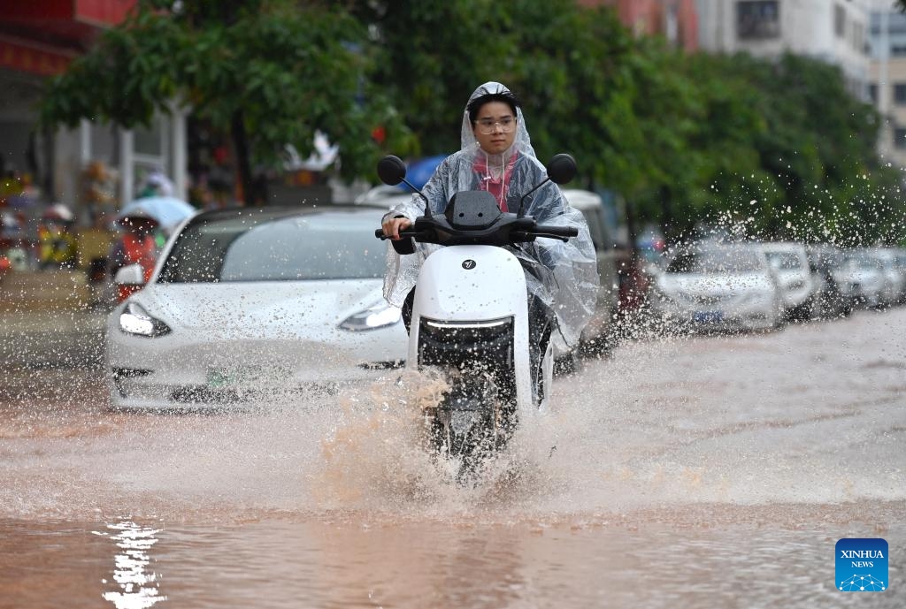 A citizen rides on a flooded street in Nanning, south China's Guangxi Zhuang Autonomous Region, May 8, 2024. Heavy rain hit Nanning on Wednesday. (Photo: Xinhua)