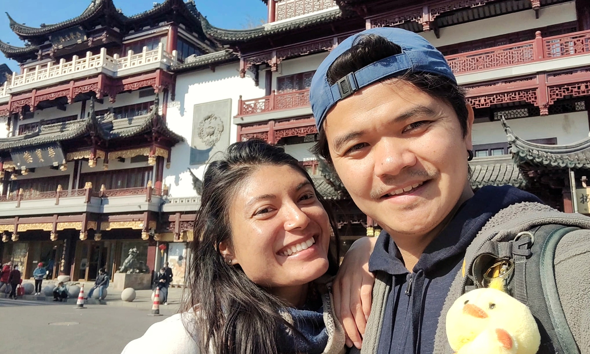 French travel vloggers Dan and Lyn pose at the surrounding of Yuyuan garden in Shanghai. Photo: Courtesy of the couple