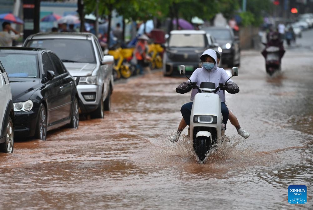 Citizens ride on a flooded street in Nanning, south China's Guangxi Zhuang Autonomous Region, May 8, 2024. Heavy rain hit Nanning on Wednesday.(Photo: Xinhua)