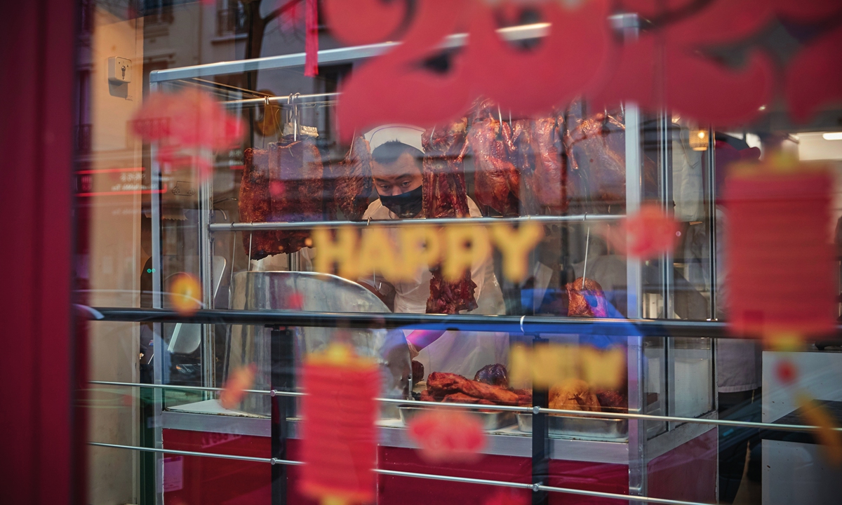 A chef prepares food in the window of one of the restaurants in La petite Asie (Little Asia), Paris' Chinatown, as the city celebrates Chinese New Year on February 01, 2022 in Paris, France. Photo: VCG