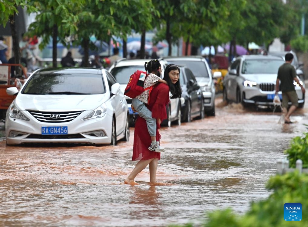 Citizens walk on a flooded street in Nanning, south China's Guangxi Zhuang Autonomous Region, May 8, 2024. Heavy rain hit Nanning on Wednesday.(Photo: Xinhua)