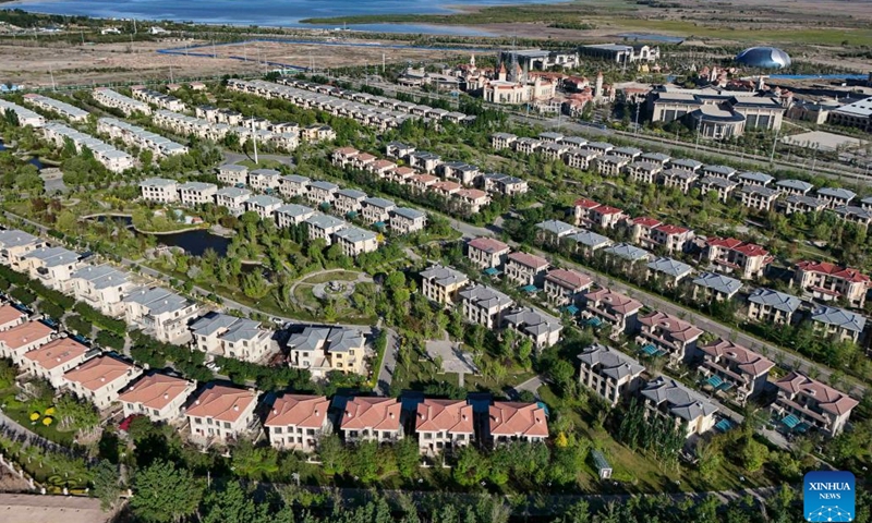 An aerial drone photo taken on May 9, 2024 shows a city view of Wujiaqu, northwest China's Xinjiang Uygur Autonomous Region. 