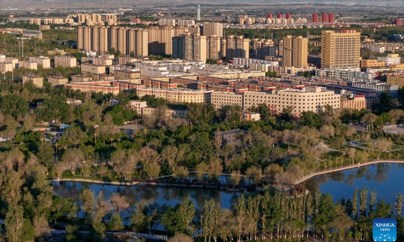 An aerial drone photo taken on May 9, 2024 shows a park and its surrounding area in Wujiaqu, northwest China's Xinjiang Uygur Autonomous Region. 