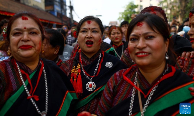 Devotees in traditional attire are seen during the celebration of Rato Machindranath festival in Lalitpur, Nepal, May 11, 2024. Local people worship Rato Machindranath, the god of rain, for a good harvest. Photo: Xinhua