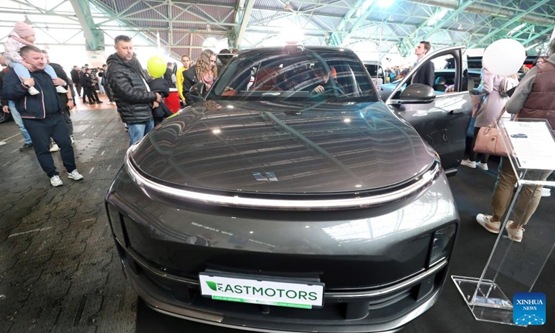 People visit an automotive exhibition in Minsk, Belarus, May 11, 2024. The two-day exhibition kicked off here on Saturday. Photo: Xinhua