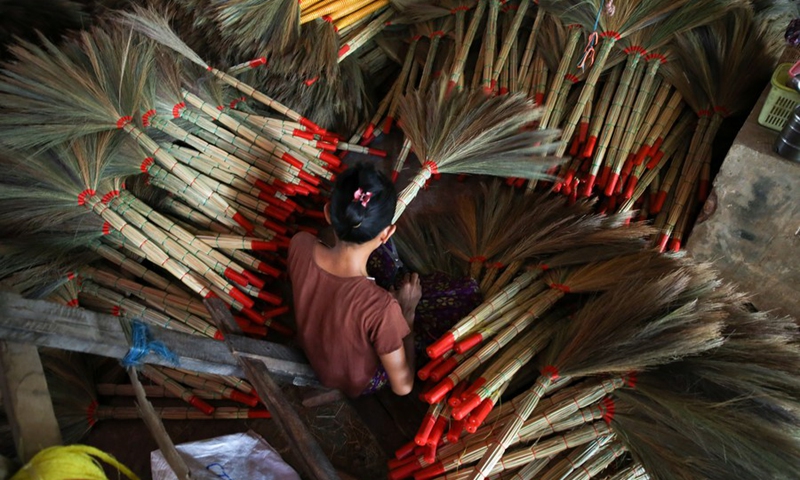 A villager makes grass brooms at a workshop in Hmawbi Township of Yangon Region, Myanmar, May 11, 2024. Photo: Xinhua