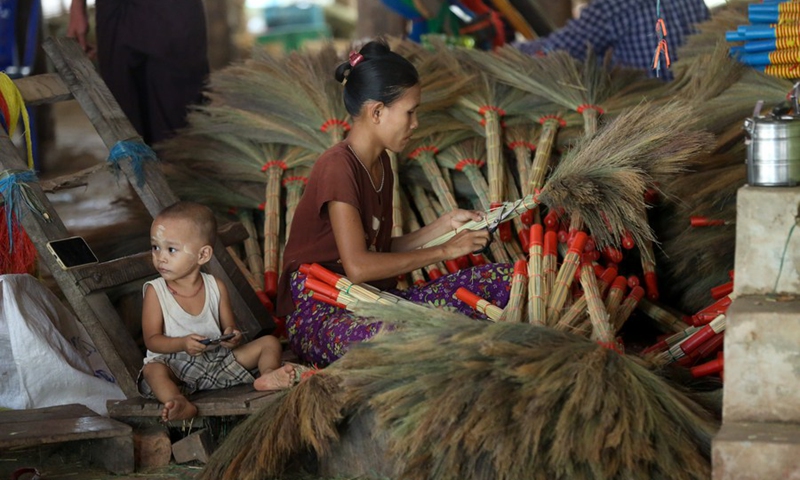 A villager makes grass brooms at a workshop in Hmawbi Township of Yangon Region, Myanmar, May 11, 2024. Photo: Xinhua