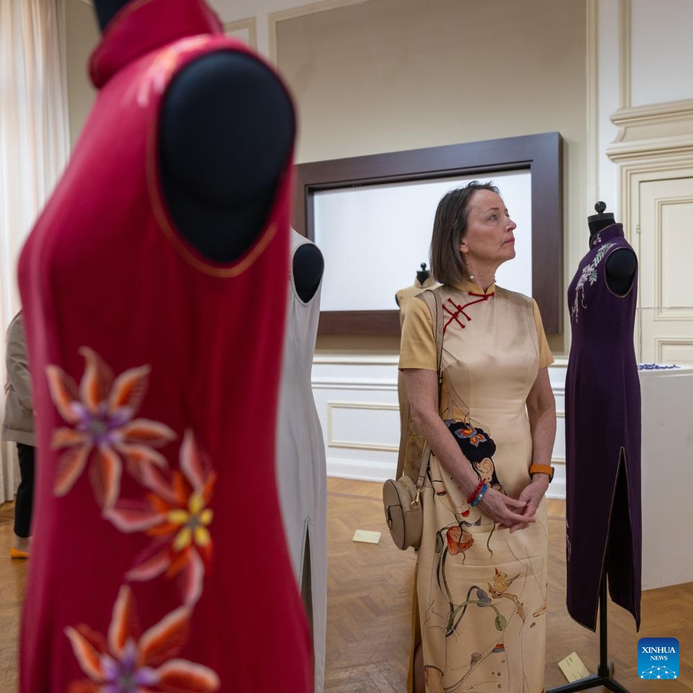 A woman visits the Elegance and Style: Qipao and Shanghai Culture at the China Cultural Center in Brussels, Belgium, on May 13, 2024.(Photo: Xinhua)