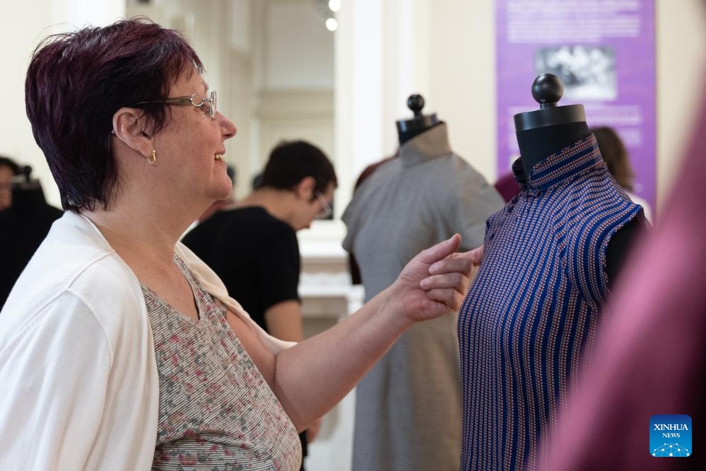 A woman visits the Elegance and Style: Qipao and Shanghai Culture at the China Cultural Center in Brussels, Belgium, on May 13, 2024.(Photo: Xinhua)