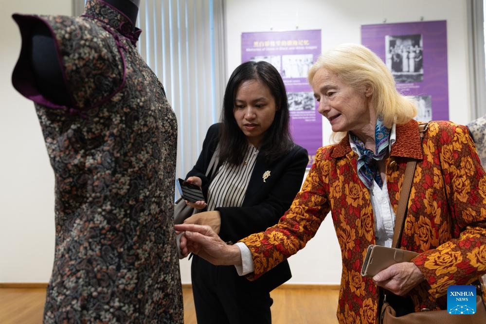 People visit the Elegance and Style: Qipao and Shanghai Culture at the China Cultural Center in Brussels, Belgium, on May 13, 2024.(Photo: Xinhua)